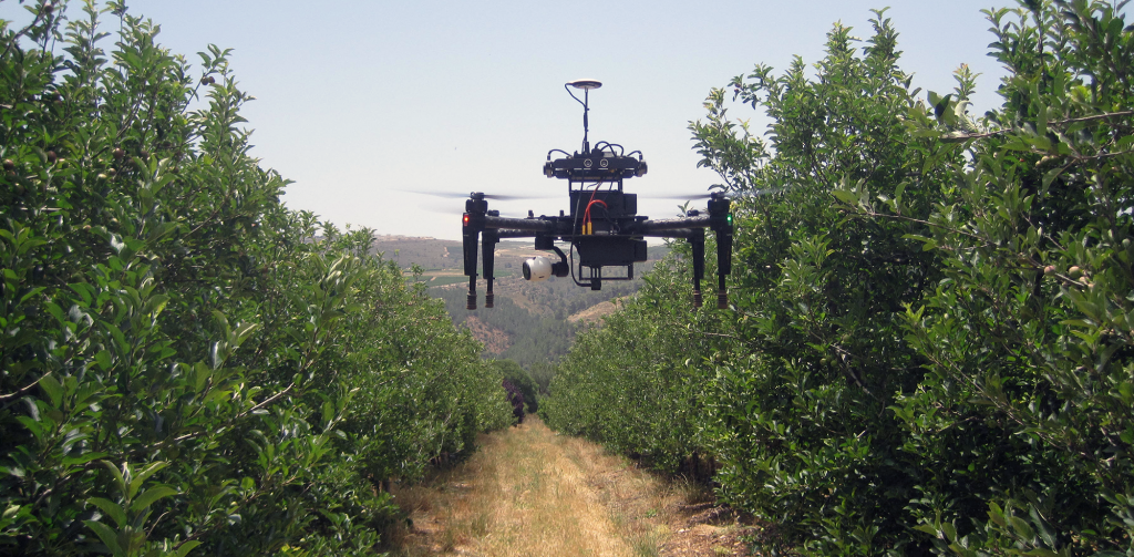 A drone flying in a farm field.